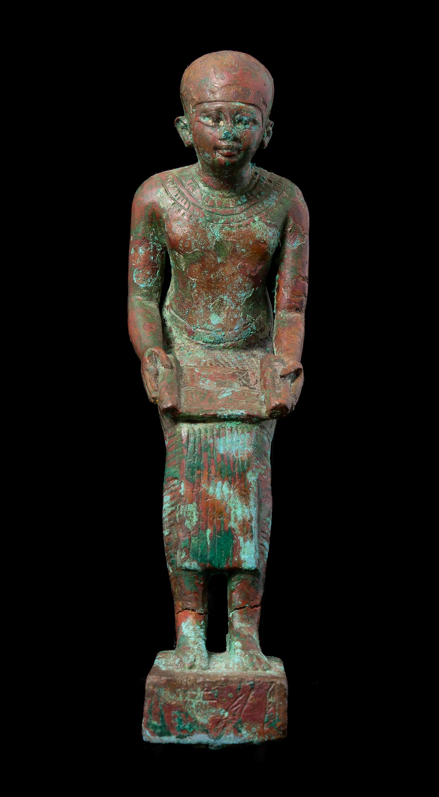 An Egyptian Bronze Seated Imhotep Height 5 1/2 inches. — LATE PERIOD TO PTOLEMAIC PERIOD, 664-30 B.C.E.
