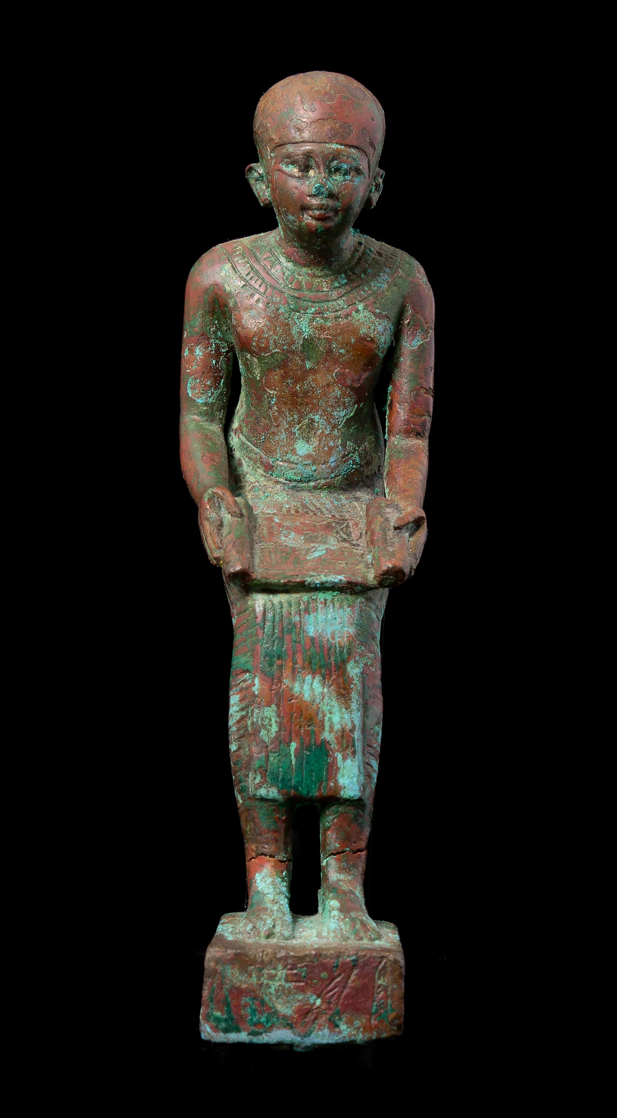 An Egyptian Bronze Seated Imhotep Height 5 1/2 inches. — LATE PERIOD TO PTOLEMAIC PERIOD, 664-30 B.C.E.