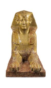 A Gold-Painted Cast Iron Model of a Sphinx Height 33 x width 19 x depth 59 inches. — 19TH CENTURY
