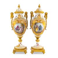 A Pair of Sèvres Style Porcelain and Gilt Bronze Mounted Urns