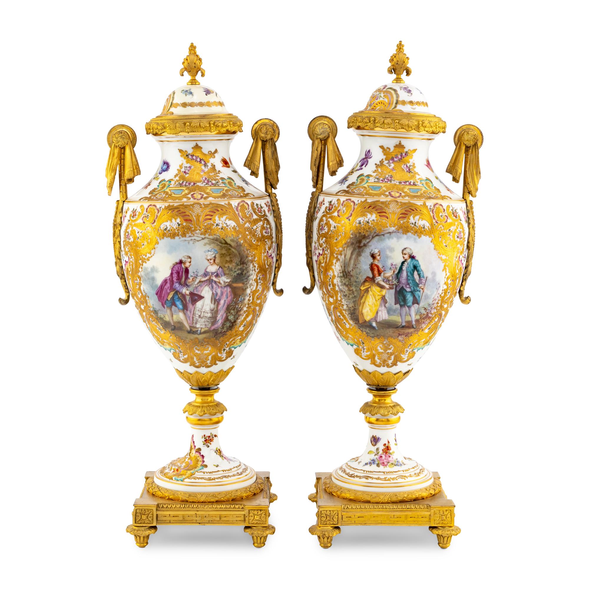 A Pair of Sèvres Style Porcelain and Gilt Bronze Mounted Urns