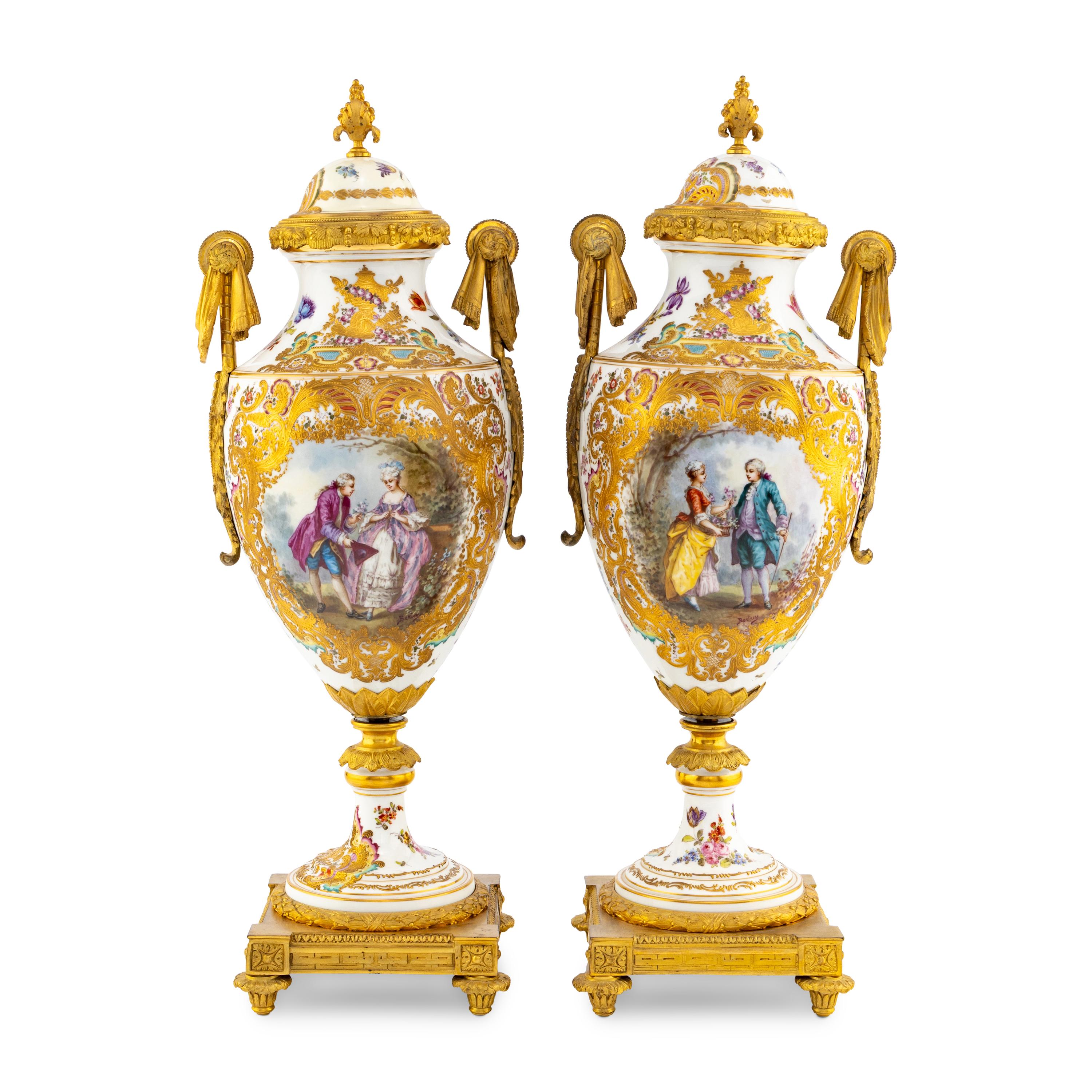 A Pair of Sèvres Style Porcelain and Gilt Bronze Mounted Urns