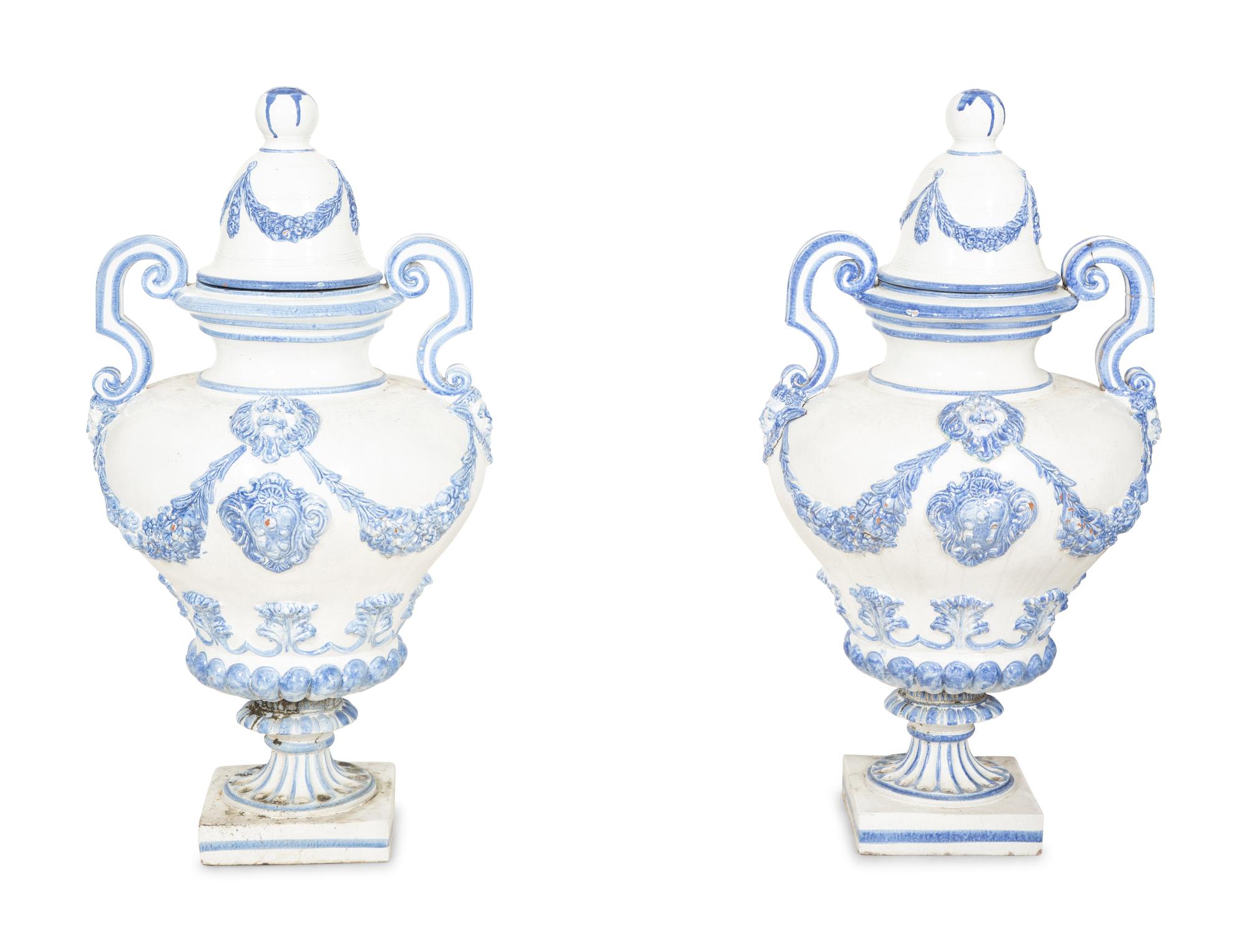 A Pair of Italian Blue and White Glazed Ceramic Covered Urns