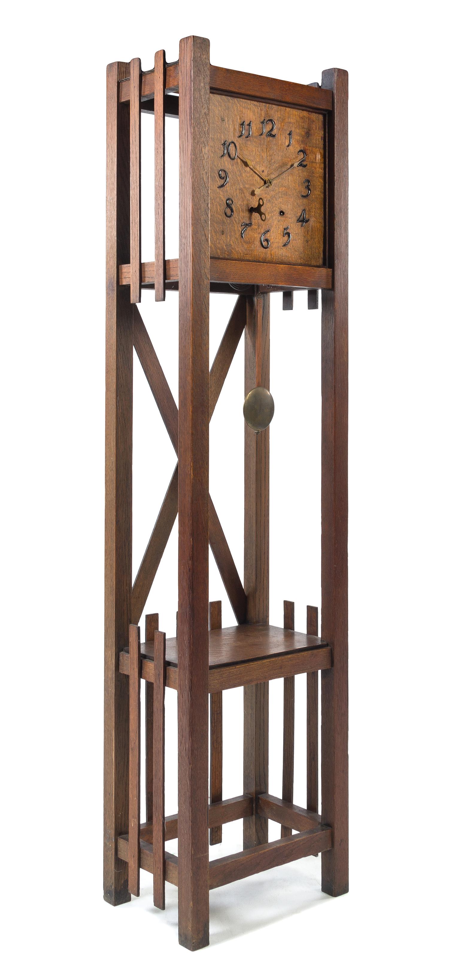 Arts and Crafts, FIRST QUARTER 20TH CENTURY, an oak case clock, with two shelves
