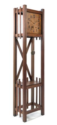 Arts and Crafts, FIRST QUARTER 20TH CENTURY, an oak case clock, with two shelves