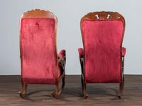 A Matched Pair of Victorian Carved Walnut Rocker Armchairs