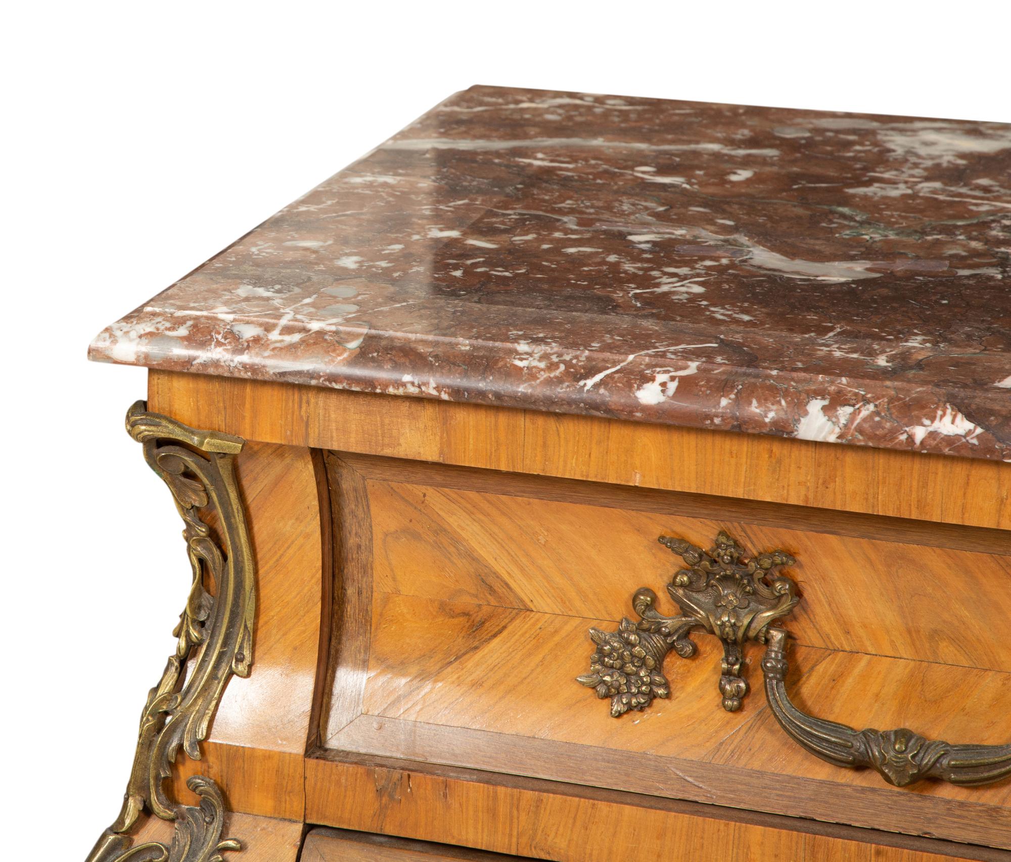 A Louis XV Style Gilt Bronze Mounted Marble-Top Bombe Commode