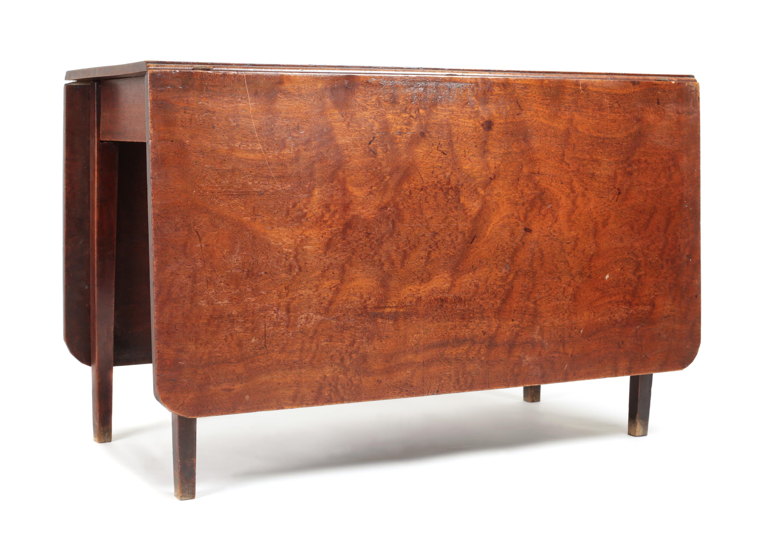 A Walnut Drop-Leaf Gate-Leg Table Height 28 1/2 x width 62 1/2 x depth 43 1/2 inches. — 19TH CENTURY