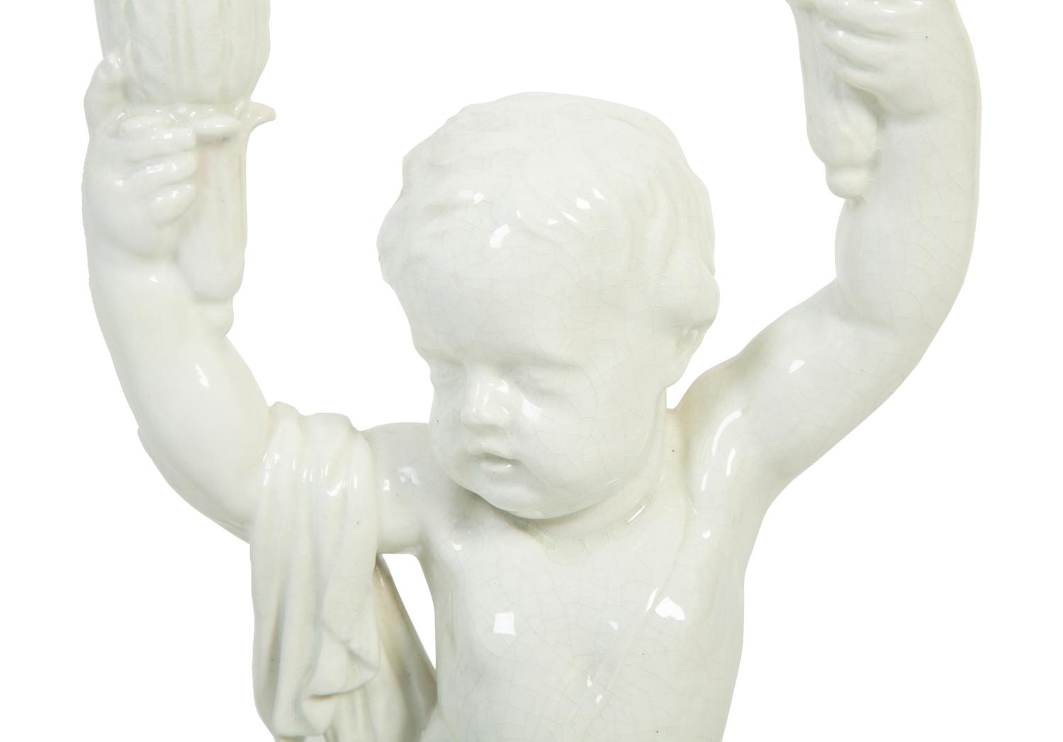 A Pair of Italian Creamware Figural Candelabra