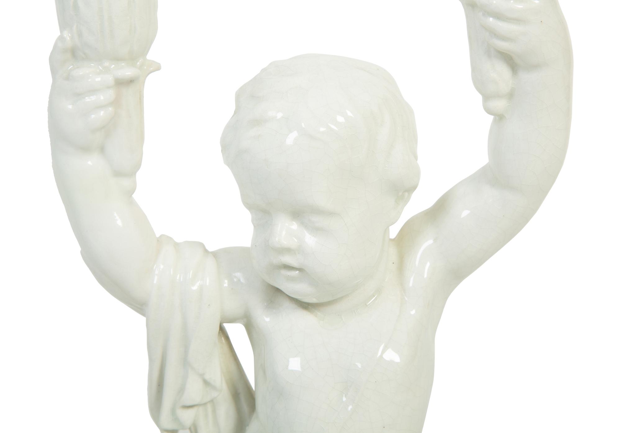 A Pair of Italian Creamware Figural Candelabra