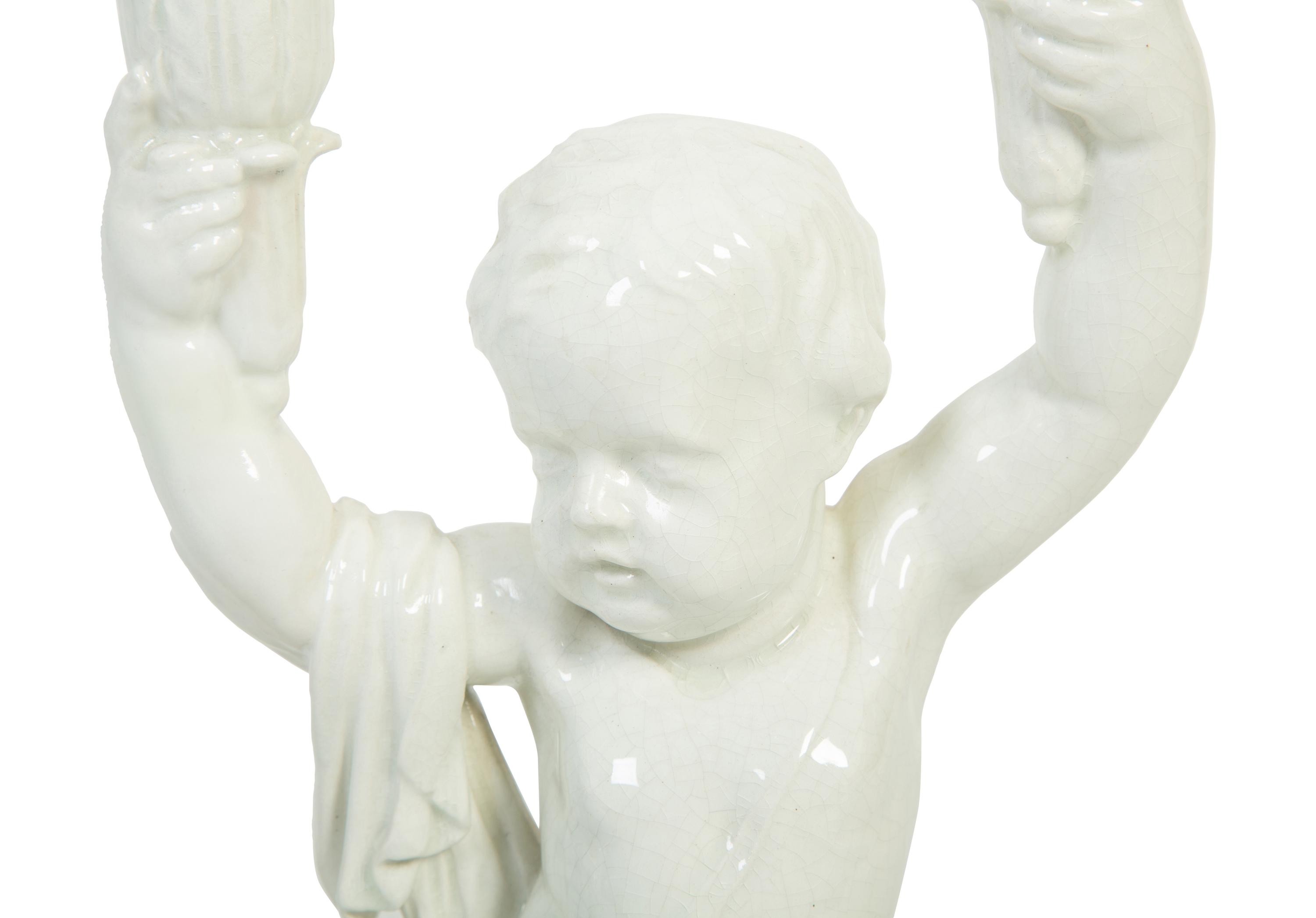 A Pair of Italian Creamware Figural Candelabra