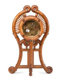 A Stick and Ball Oak Mantel Clock