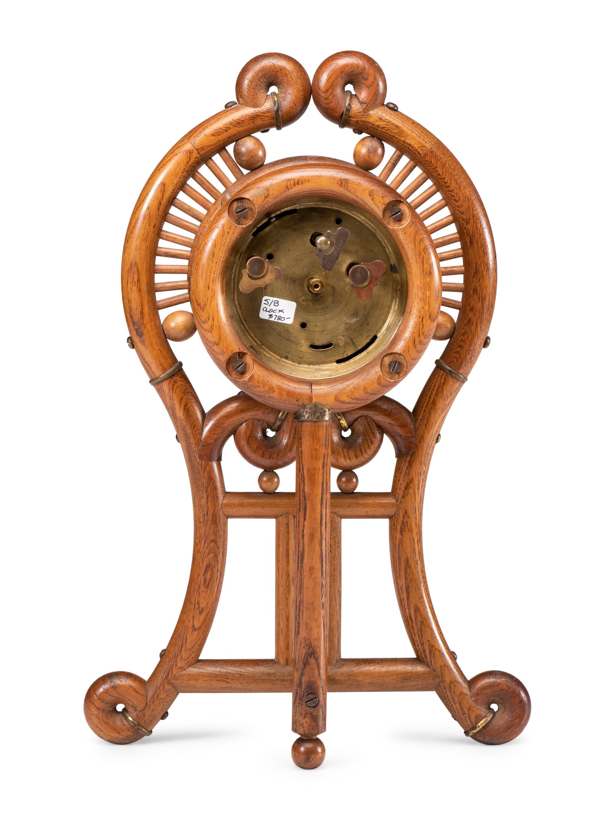 A Stick and Ball Oak Mantel Clock