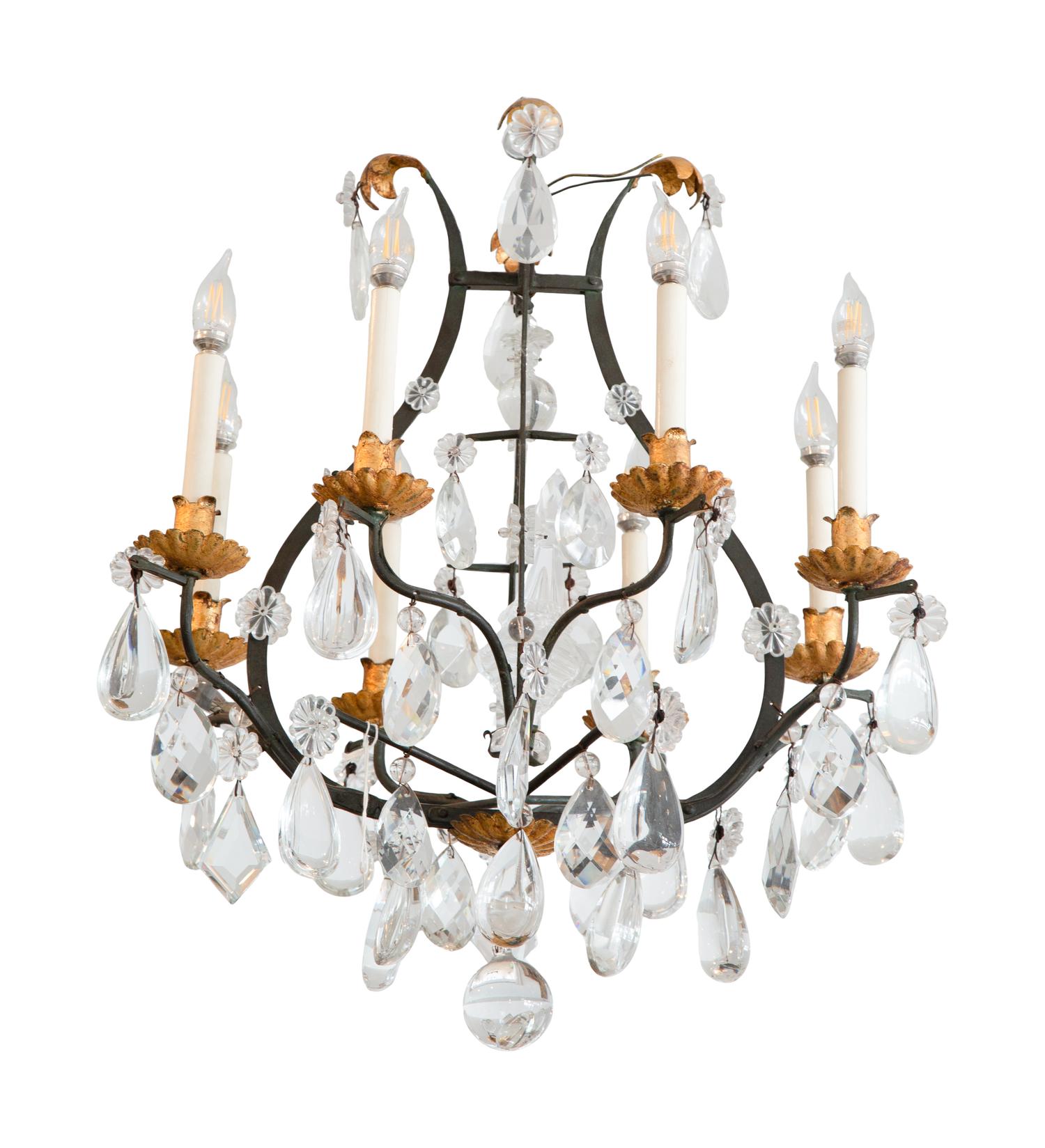 An Eight-Light Cast and Gilt Metal Chandelier with Crystal Drops.