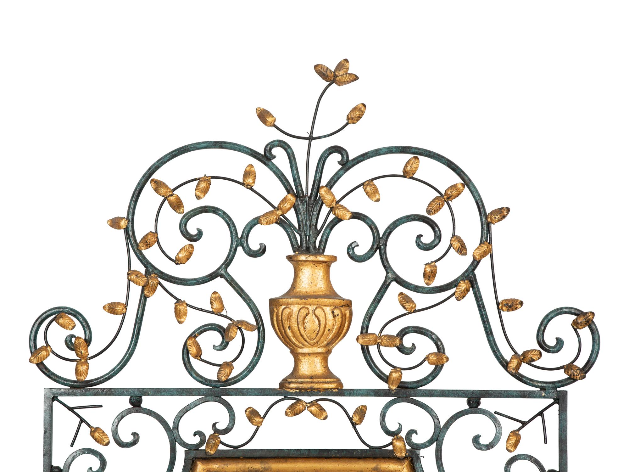 A Painted and Parcel Gilt Scrolled Wrought Iron Mirror