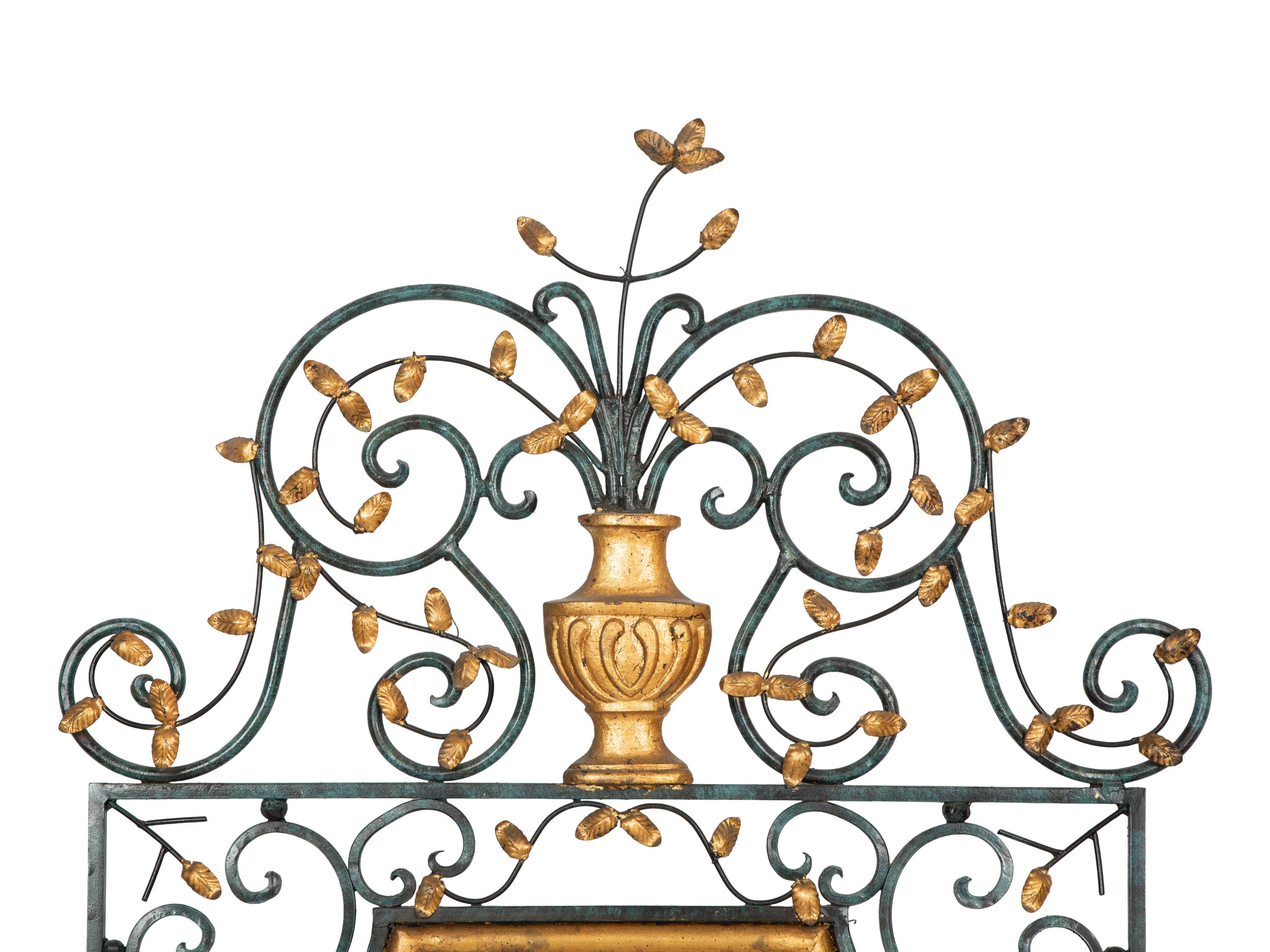 A Painted and Parcel Gilt Scrolled Wrought Iron Mirror