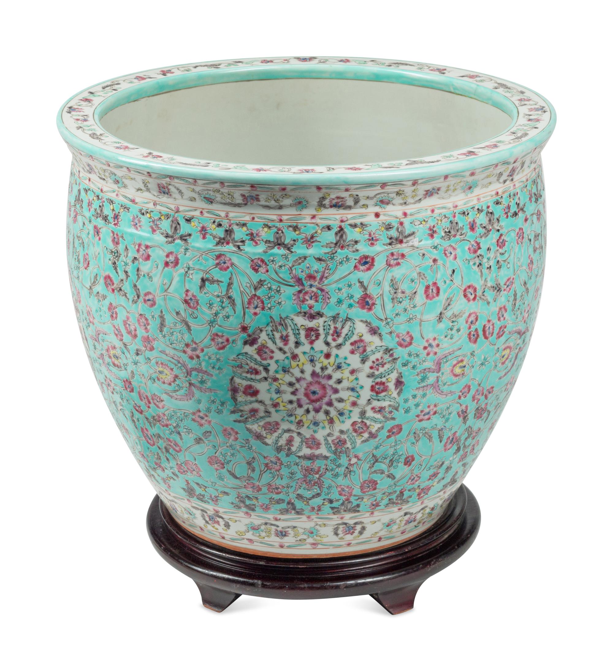 A Chinese Porcelain Fish Bowl and Wood Stand