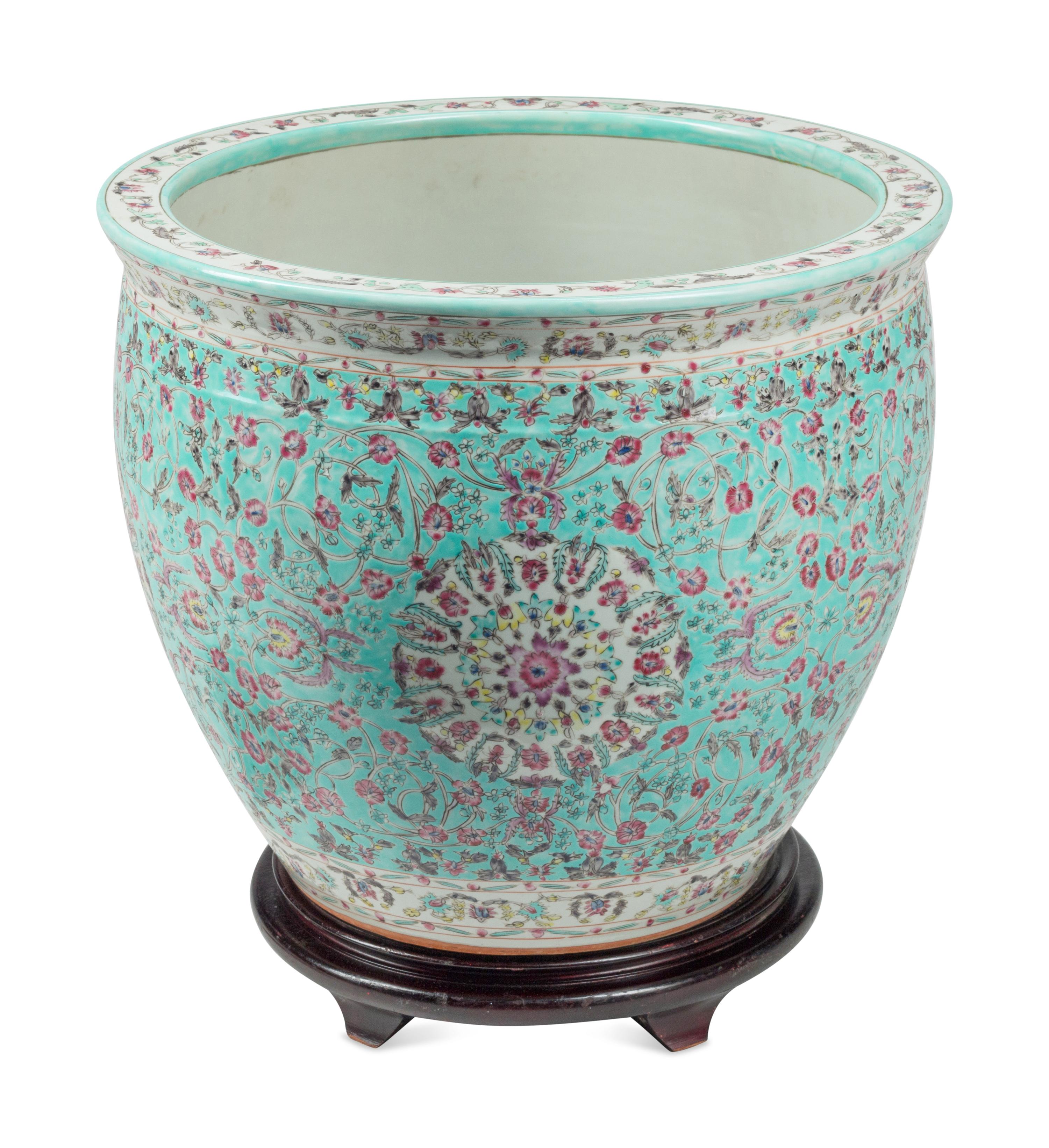 A Chinese Porcelain Fish Bowl and Wood Stand