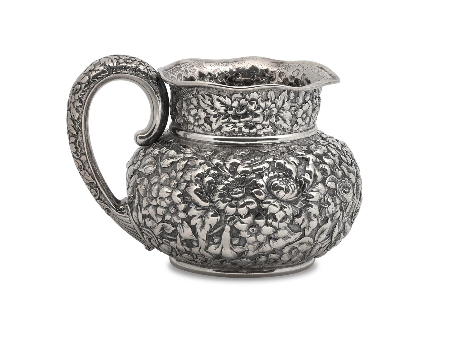 An American Silver Floral Repoussé Water Pitcher
