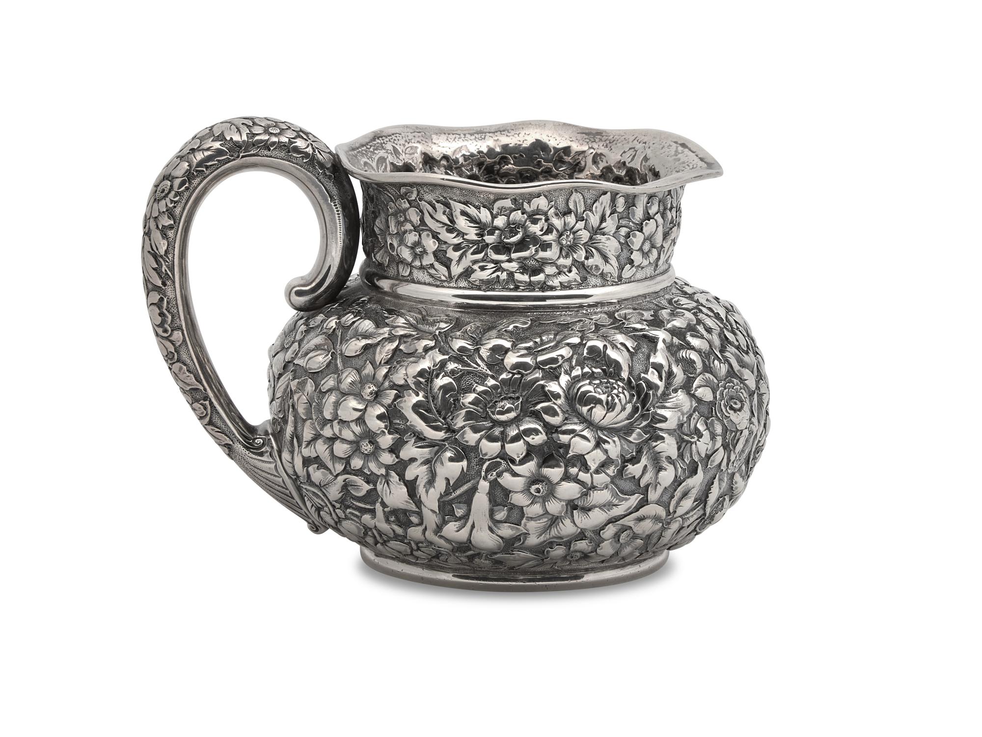 An American Silver Floral Repoussé Water Pitcher