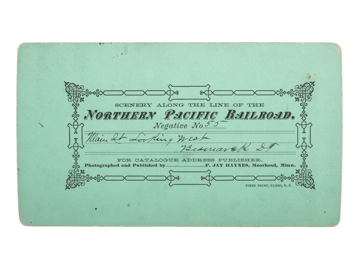 [WESTERN AMERICANA]. HAYNES, F.J., photographer. Stereview of Main Street, Bismarck, Dakota Territory.