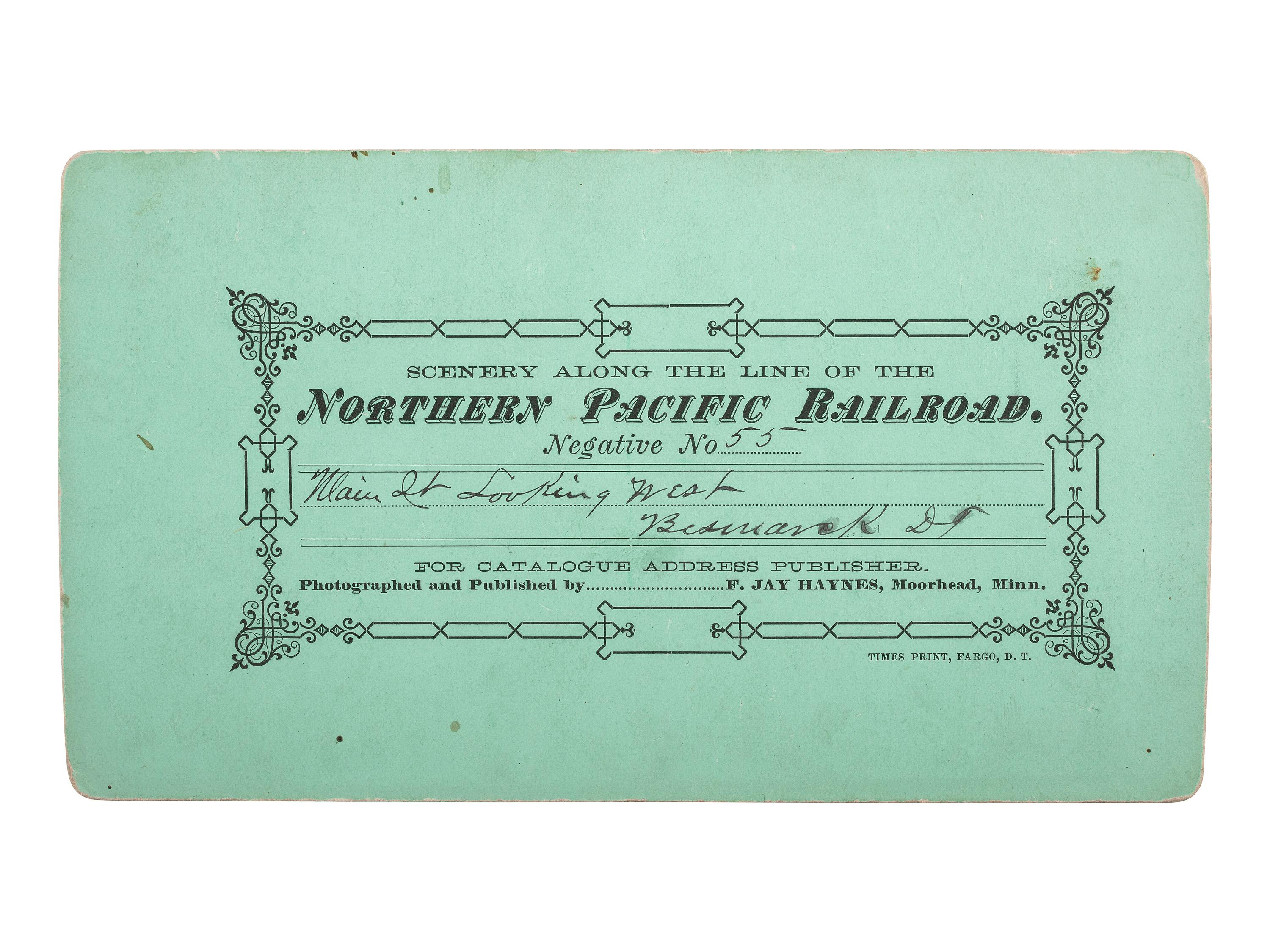[WESTERN AMERICANA]. HAYNES, F.J., photographer. Stereview of Main Street, Bismarck, Dakota Territory.