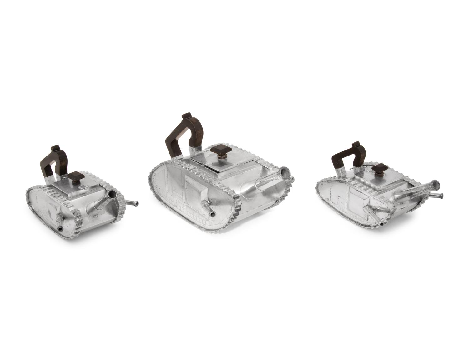 An American Silver Three-Piece Tea Service in the Form of Armored Tanks