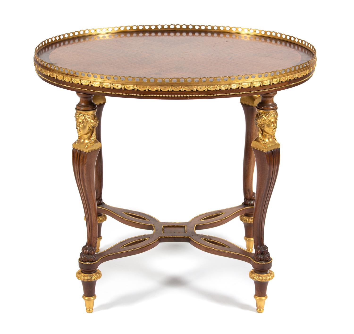 A Louis XVI Style Gilt Bronze Mounted Kingwood and Tulipwood Occasional Table Height 27 x width 29 3/4 x depth 23 3/4 inches. — EARLY 20TH CENTURY