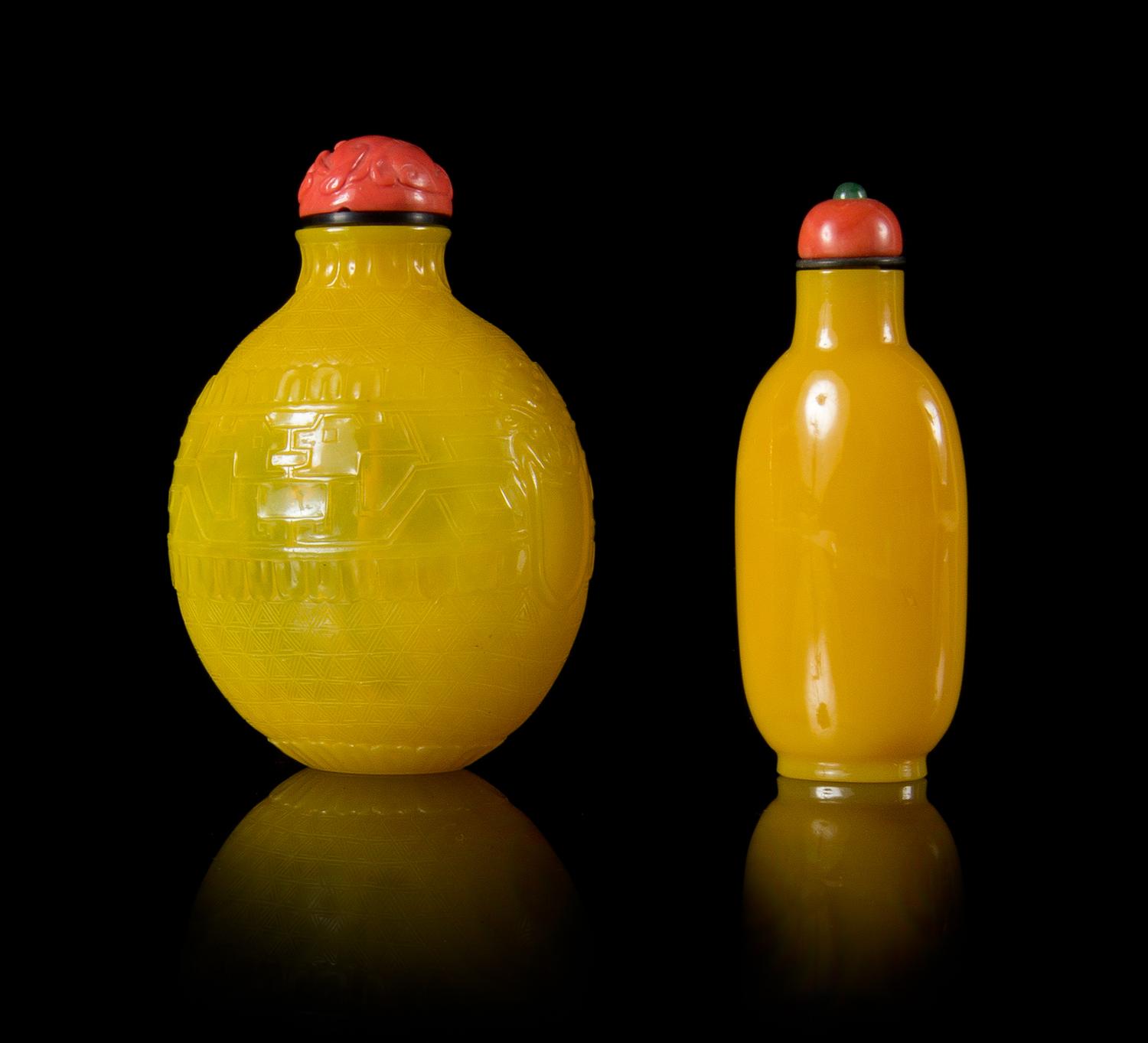Two Yellow Peking Glass Snuff Bottles Height of larger 3 1/4 inches.