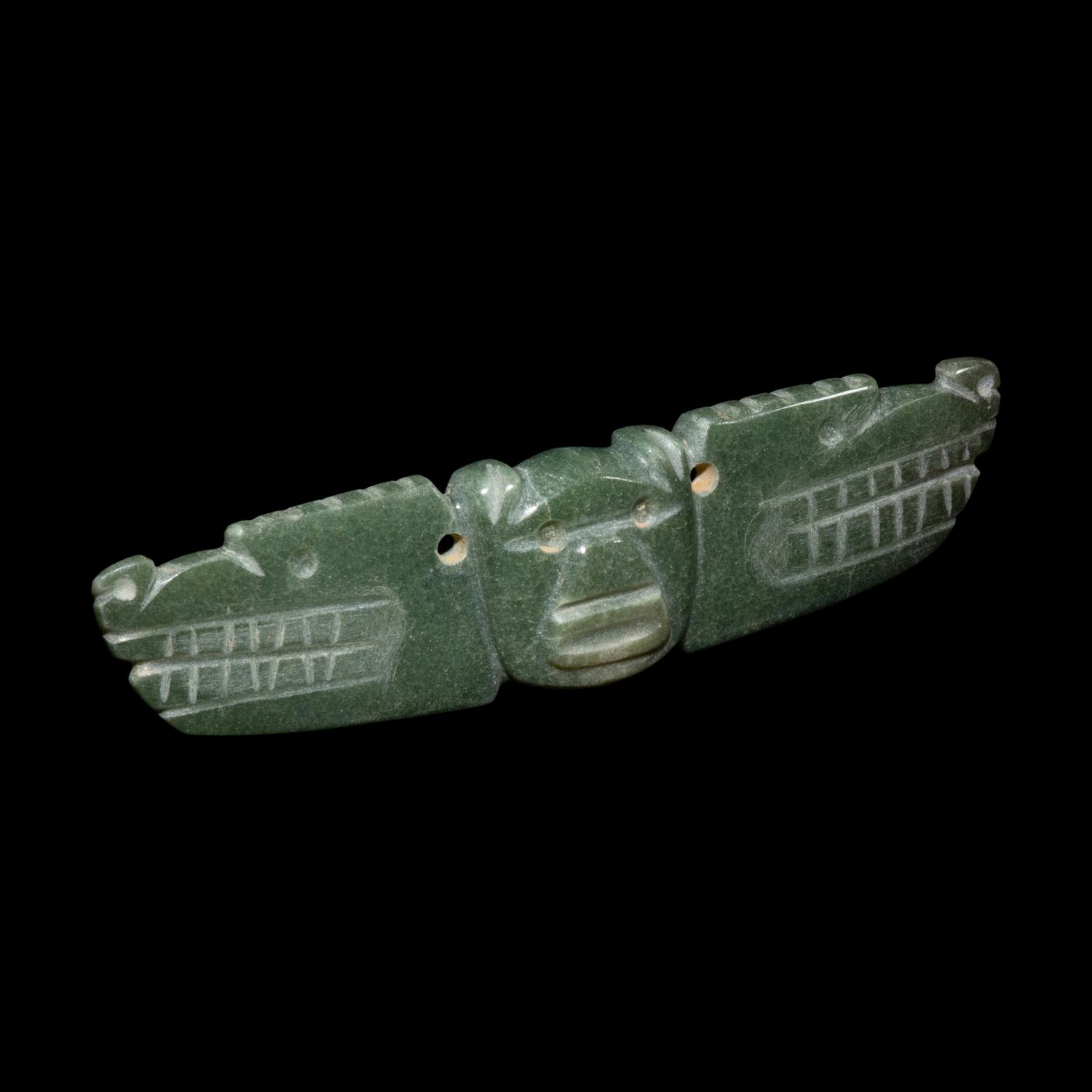 A Costa Rican Jade Two-Headed Bar Pendant