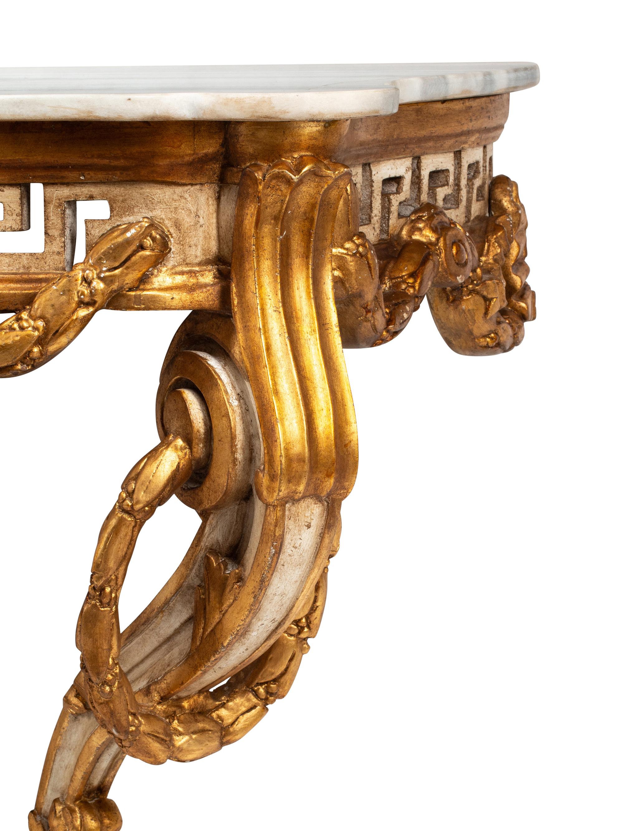 A Pair of Italian Neoclassical Style White Painted and Parcel Gilt Marble-Top Console Tables