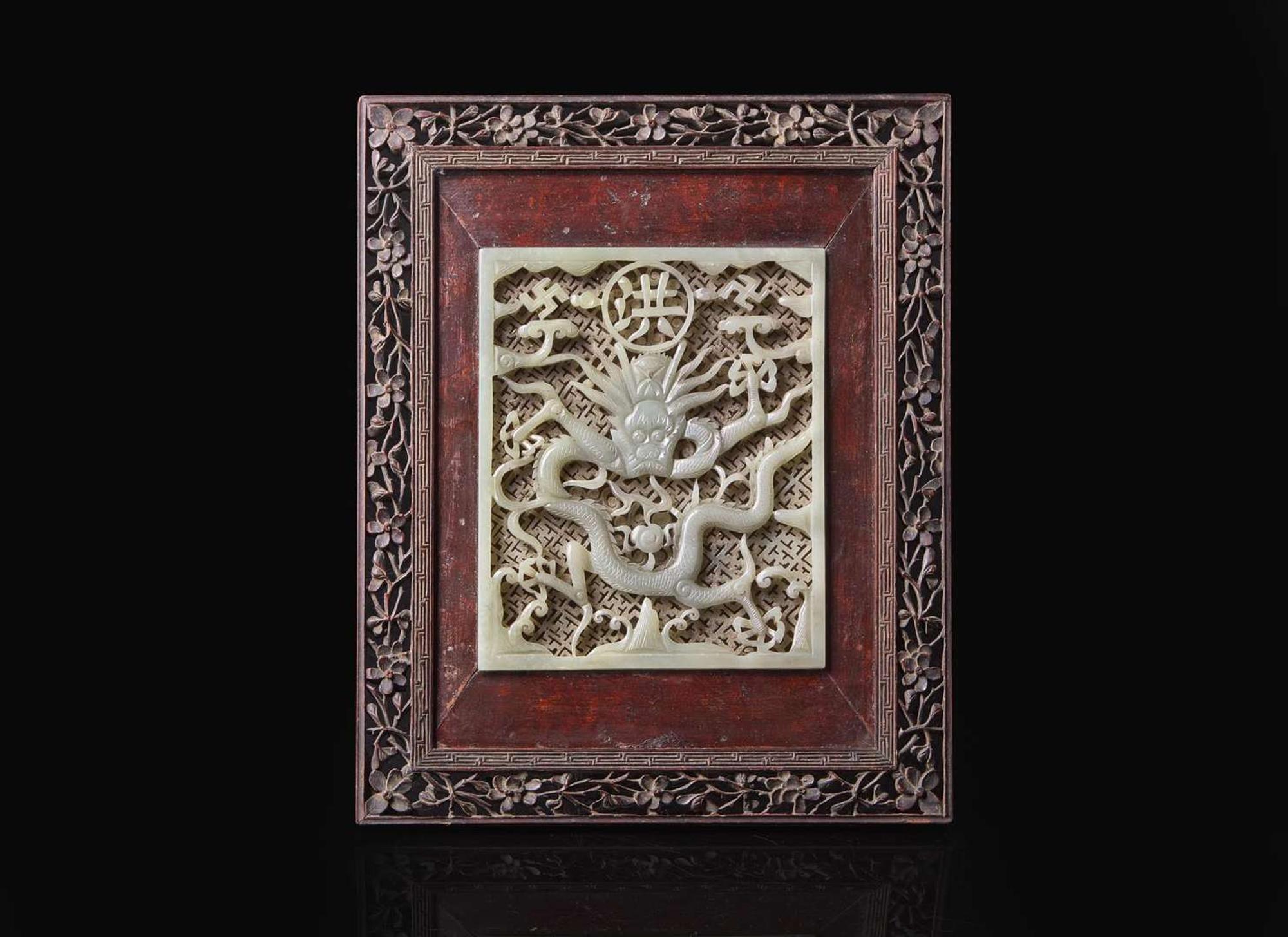 A Chinese carved and pierced pale celadon jade "Dragon" plaque 青玉龍紋硯屏