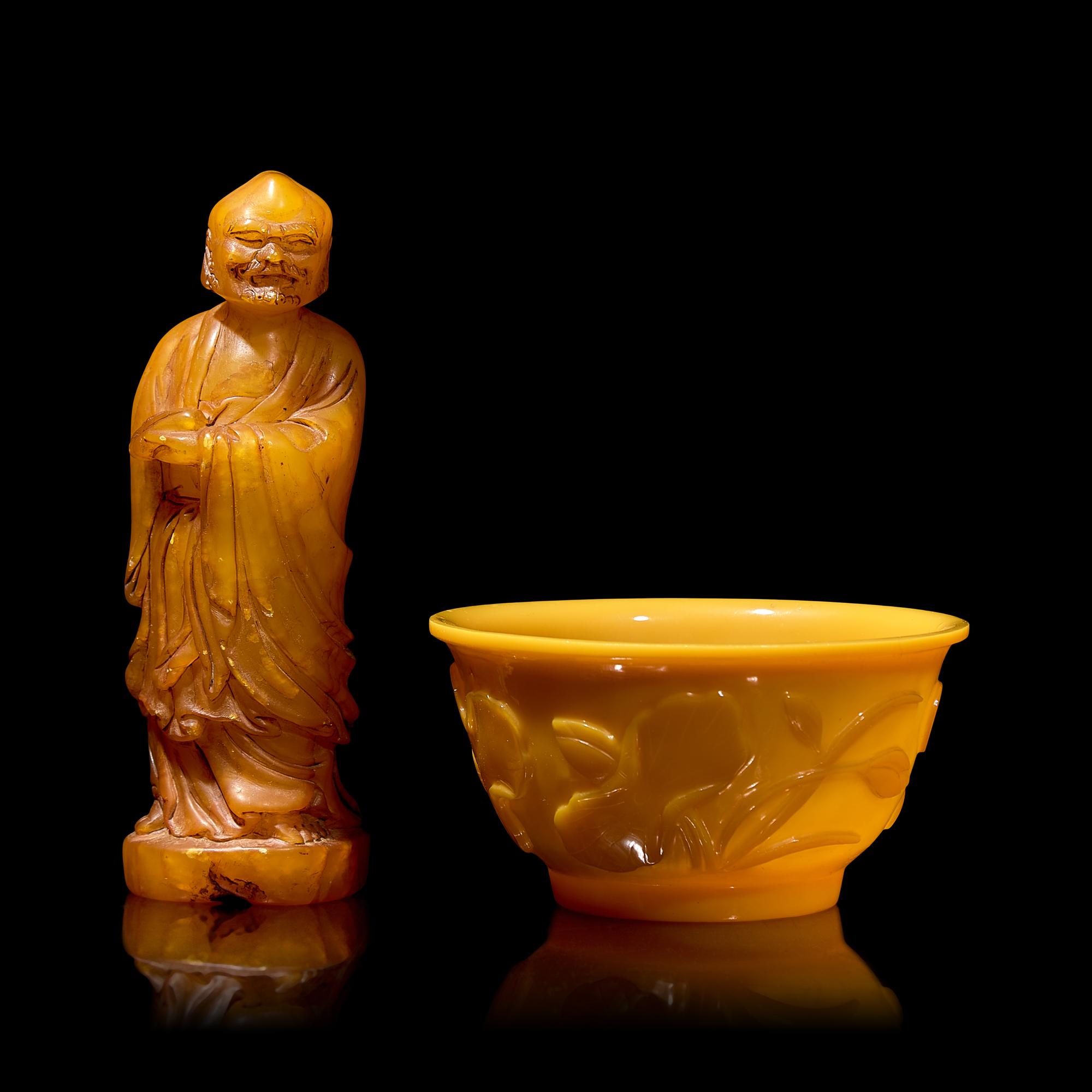 A Chinese Carved Stone "Luohan" Seal and a Yellow "Peking" Glass Bowl 壽山石雕羅漢和黃料花卉紋盌各一
