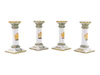 A Set of Four French Faience Candlesticks