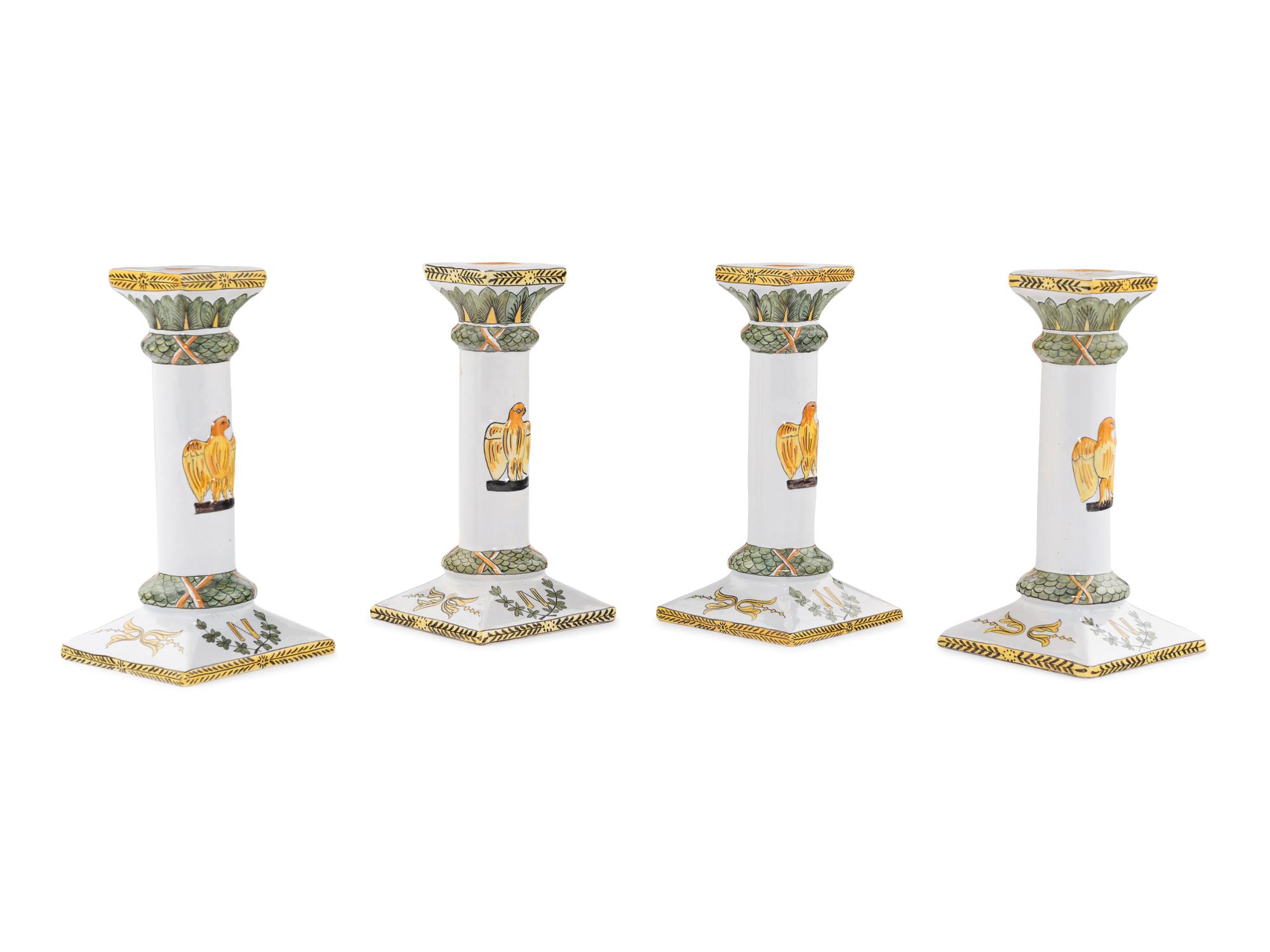 A Set of Four French Faience Candlesticks
