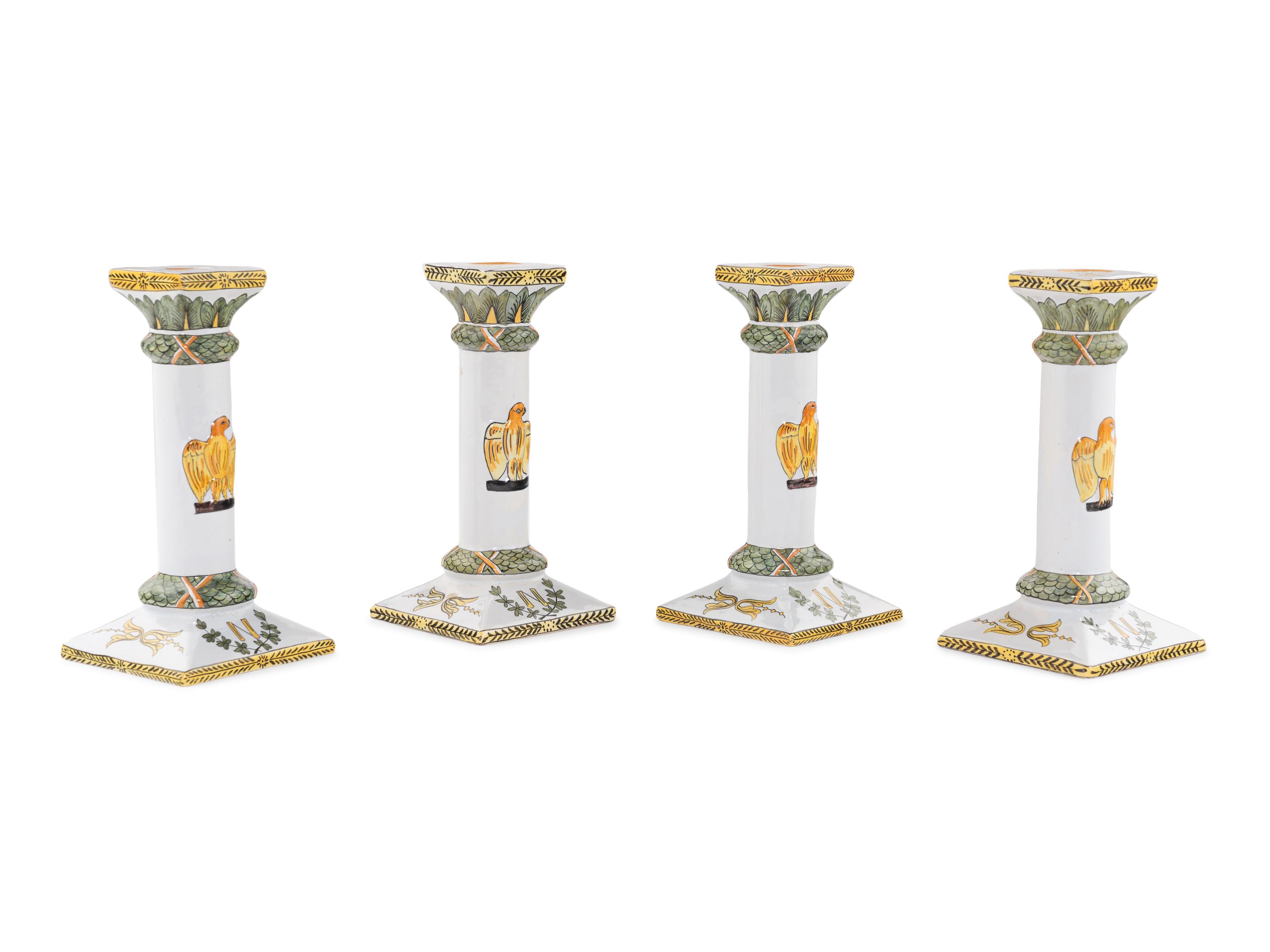 A Set of Four French Faience Candlesticks