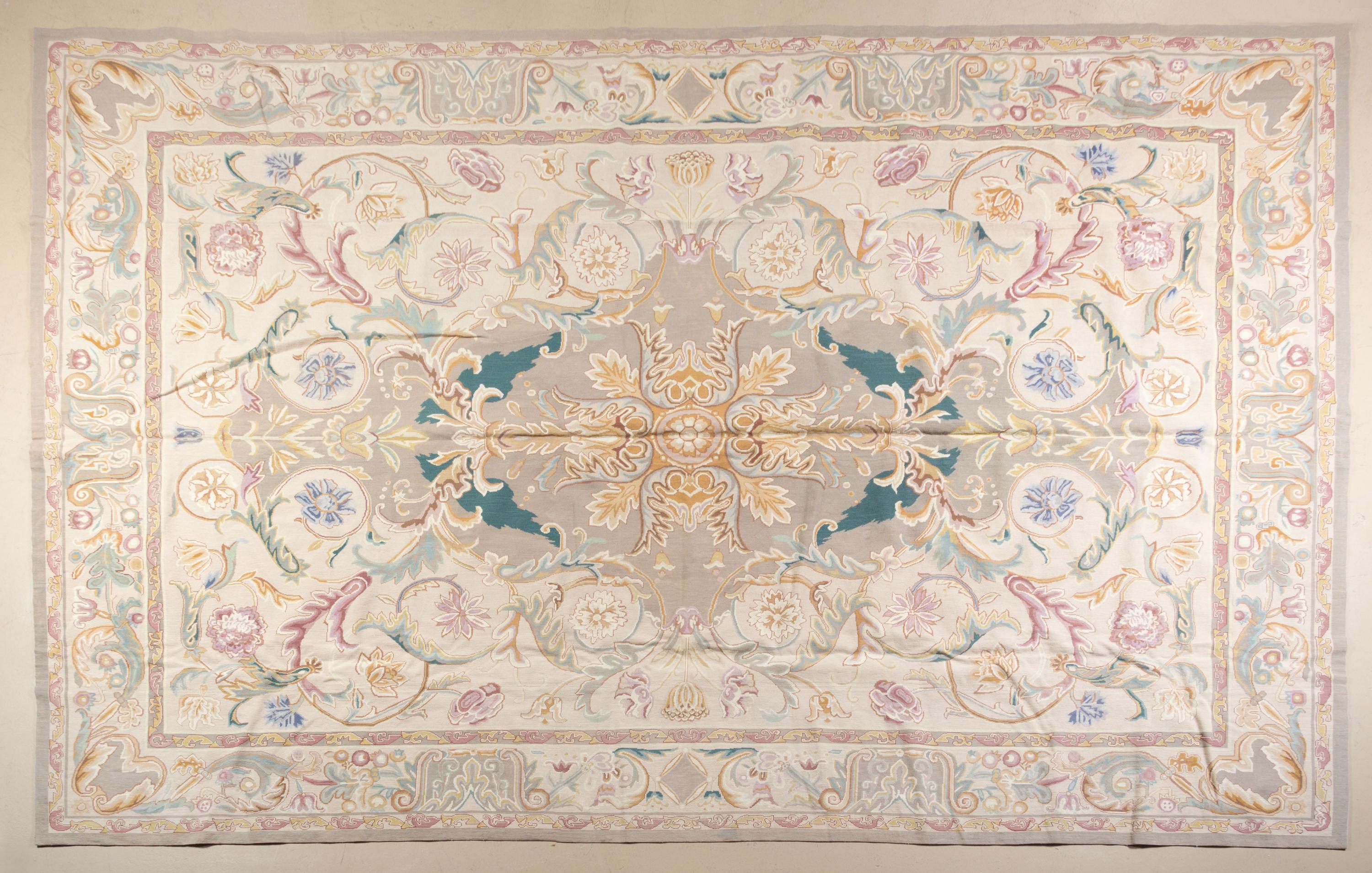 A Textile Needle Point Rug 13 feet 5 inches x 9 feet 4 1/2 inches.