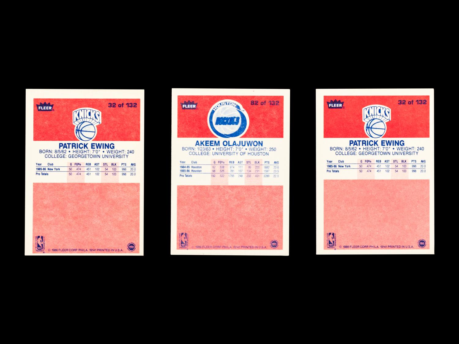 A Group of Three 1986 Fleer Patrick Ewing and Hakeem Olajuwon Rookie Basketball Cards,