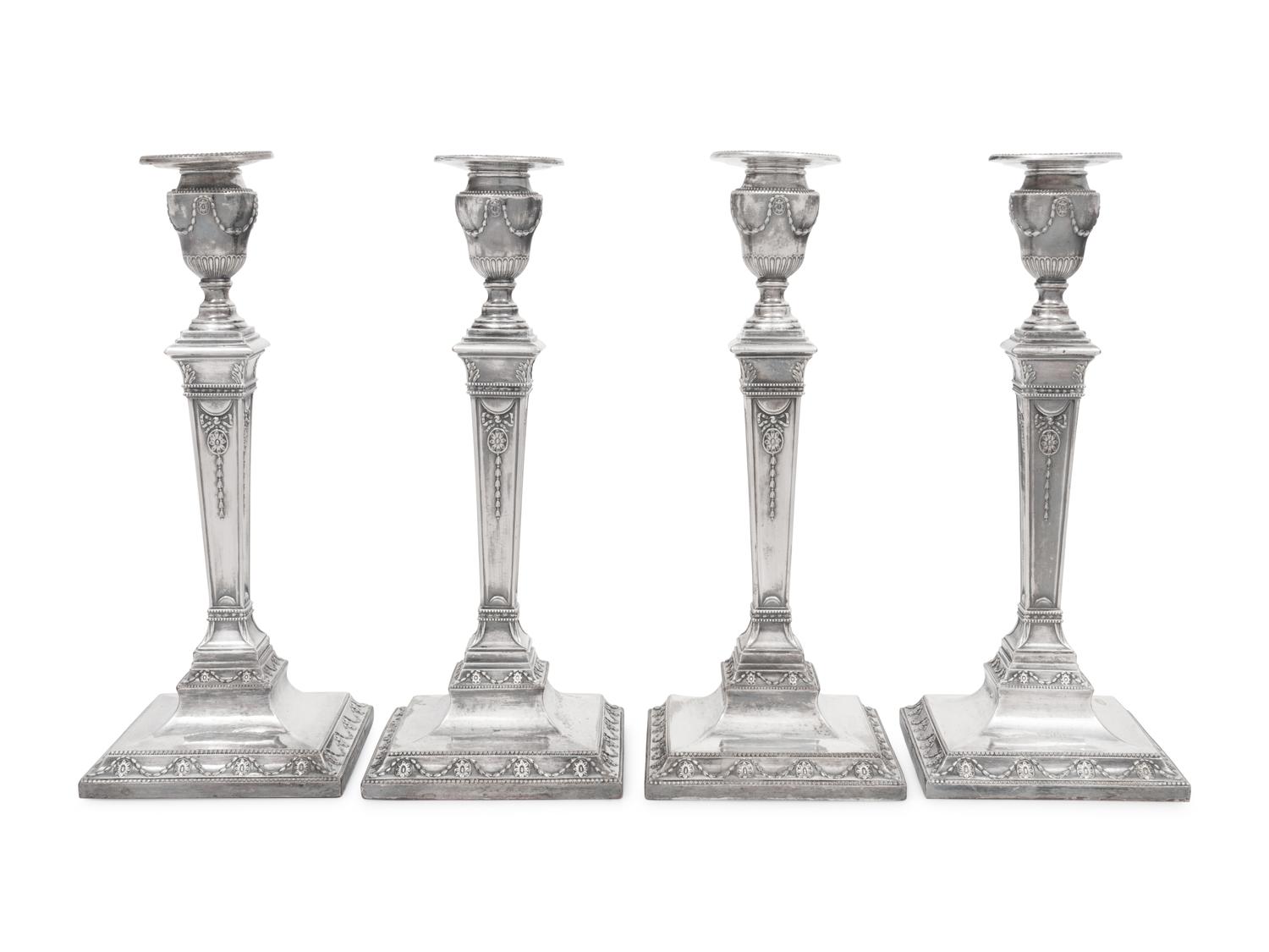 A Set of Four Silver-Plate Candlesticks