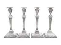 A Set of Four Silver-Plate Candlesticks