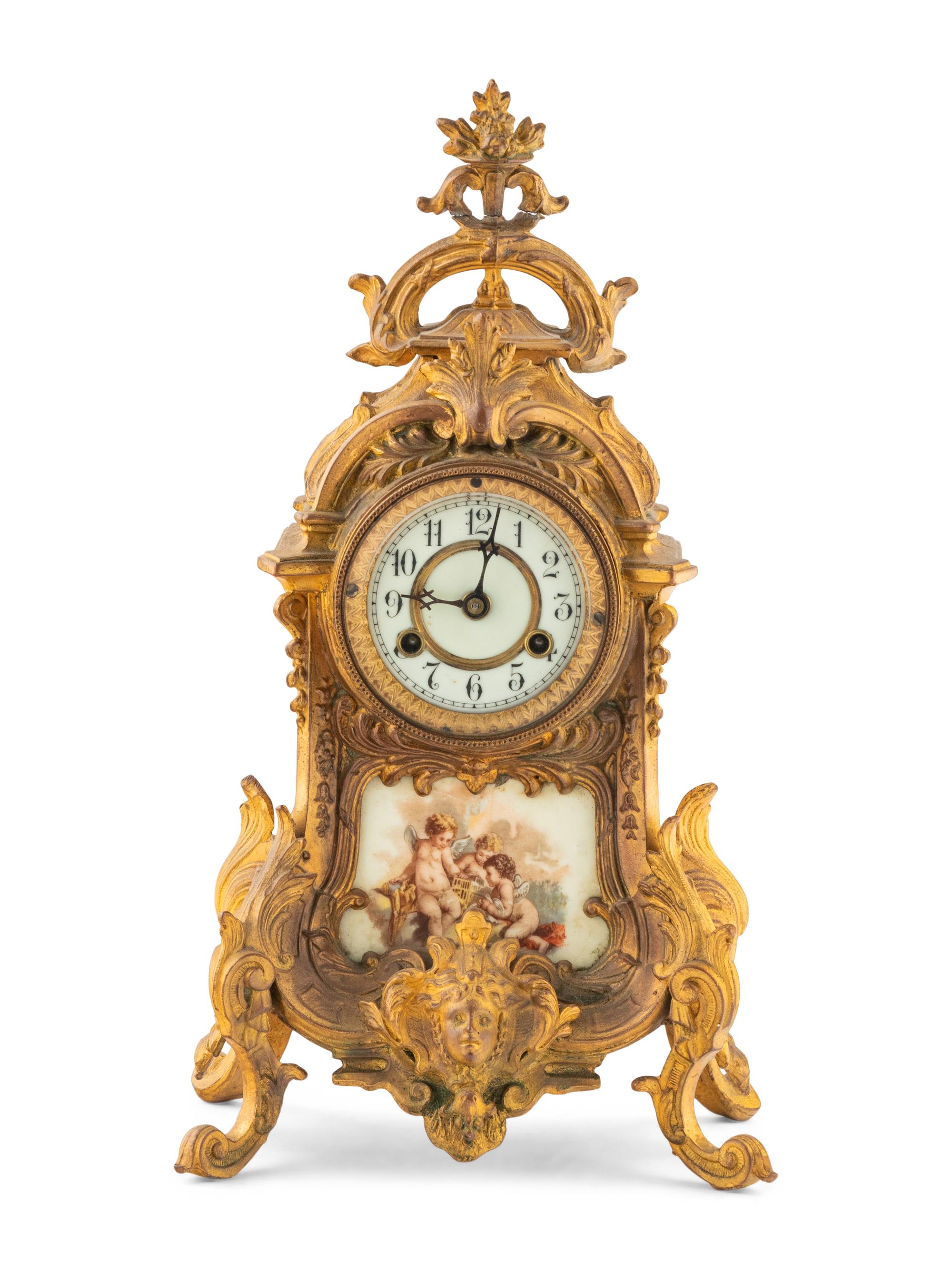 A Porcelain-Mounted Gilt Metal Mantel Clock