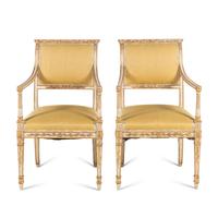 A Pair of Italian Neoclassical Style White-Painted and Parcel Gilt Fauteuils