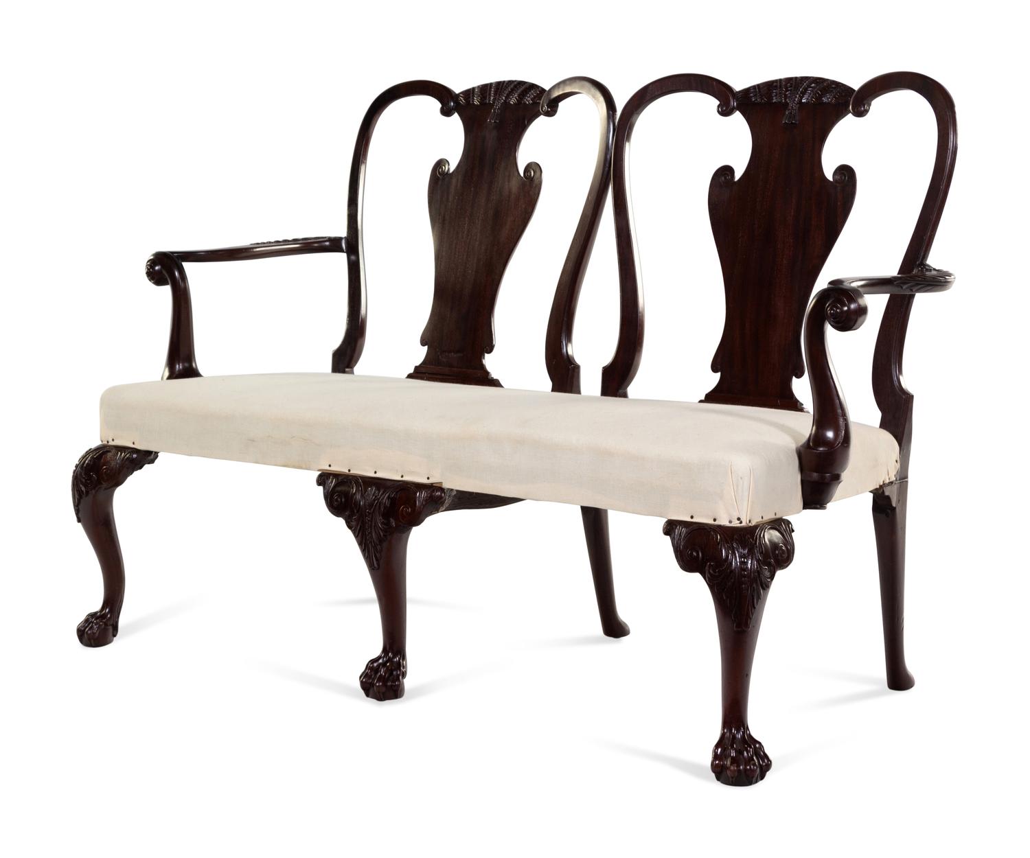 A George III Carved and Figured Mahogany Double-Chair Back Settee