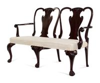 A George III Carved and Figured Mahogany Double-Chair Back Settee
