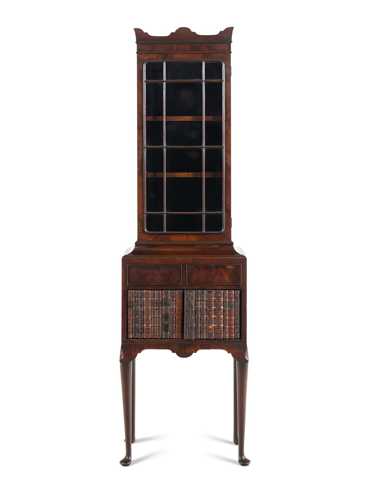 A Regency Mahogany and Faux-Book Decorated Vitrine Cabinet on Stand