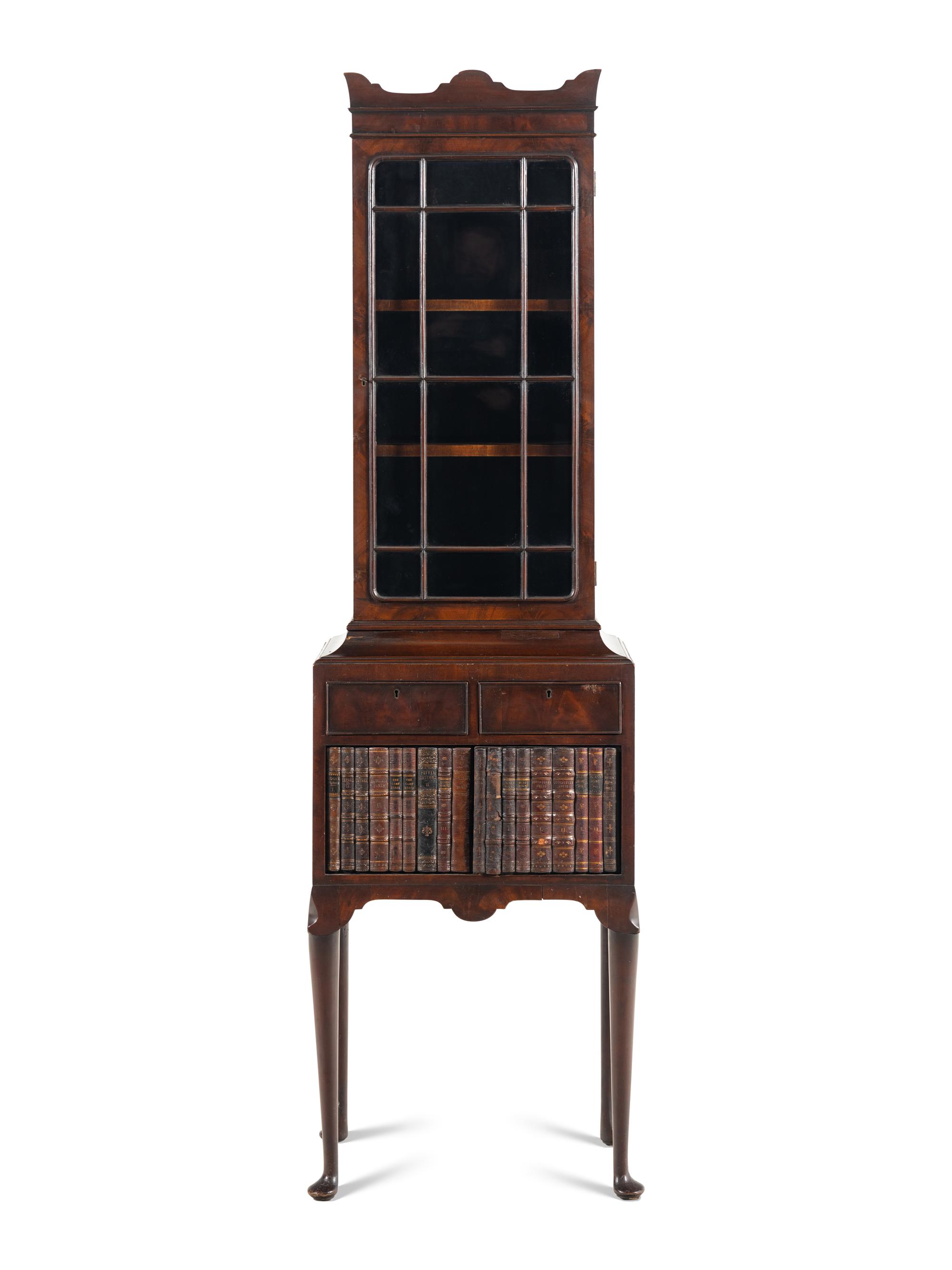 A Regency Mahogany and Faux-Book Decorated Vitrine Cabinet on Stand