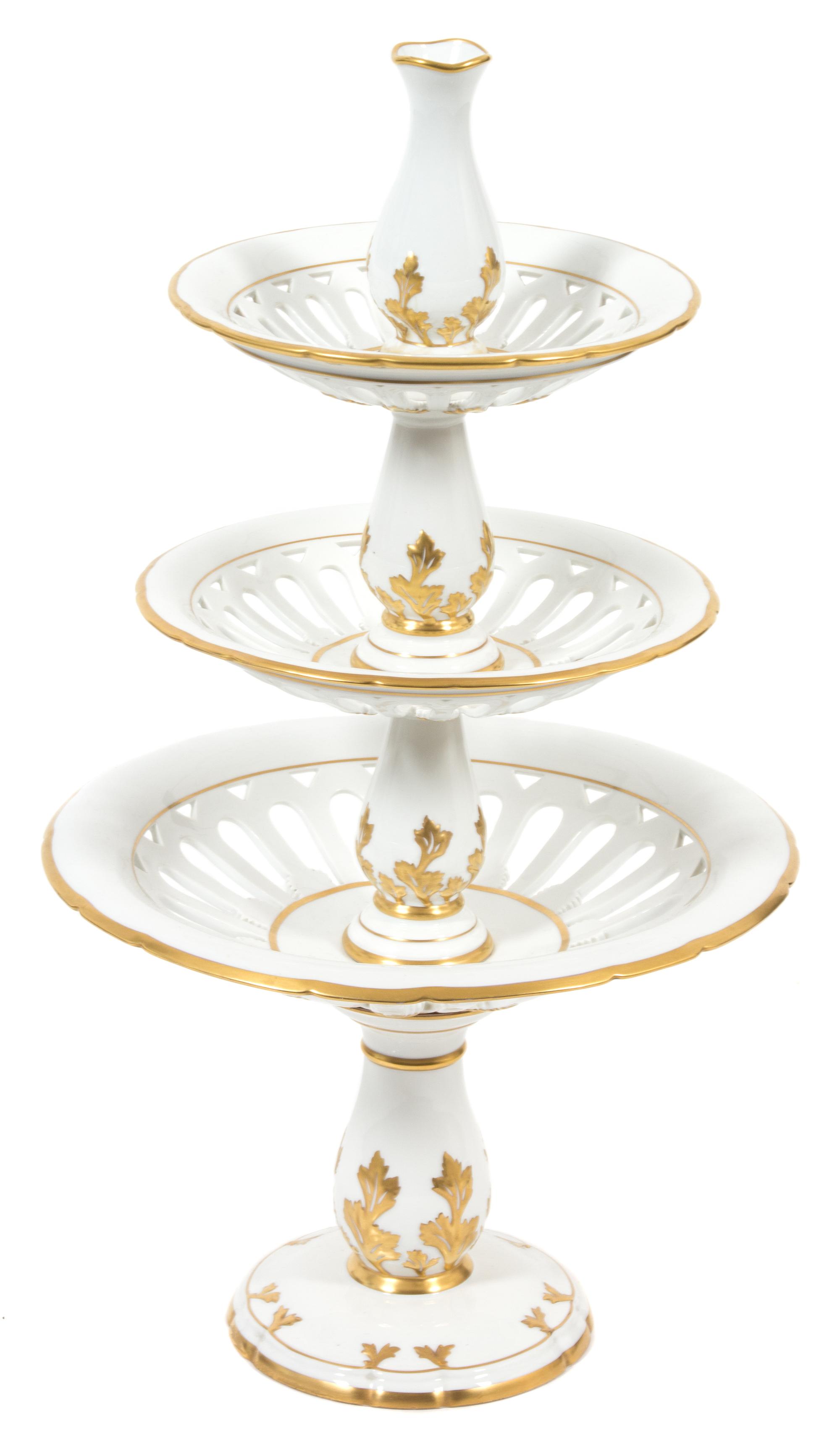 A Paris Porcelain Three-Tier Dessert Tazza Height 27 1/2 x diameter 15 inches. — 19TH CENTURY