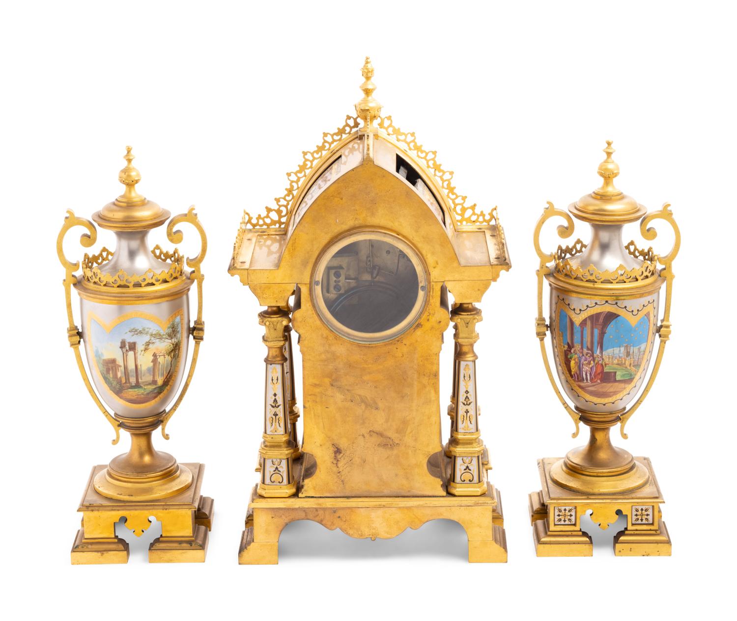 A French Gilt Bronze and Painted Porcelain Clock Garniture