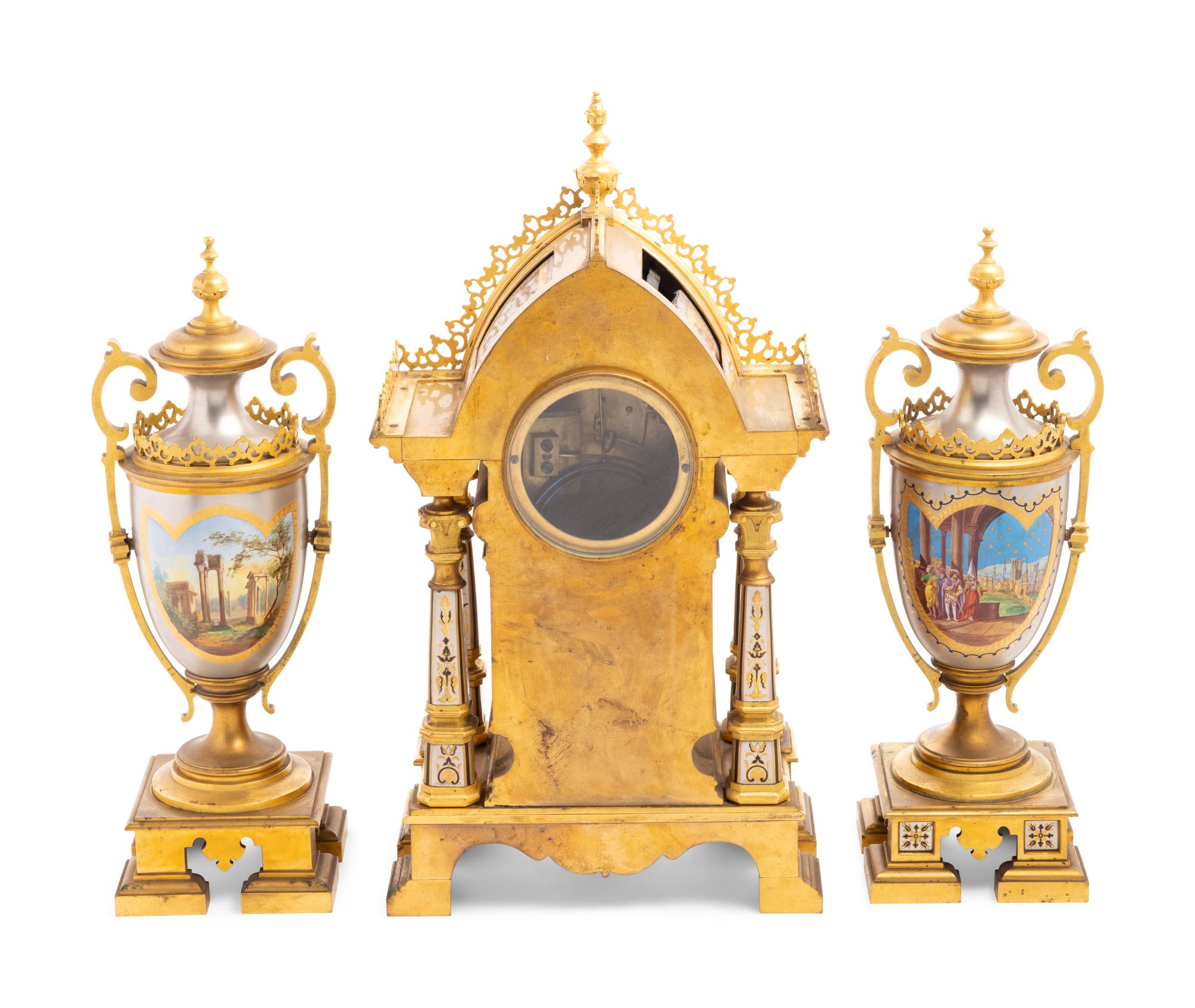 A French Gilt Bronze and Painted Porcelain Clock Garniture