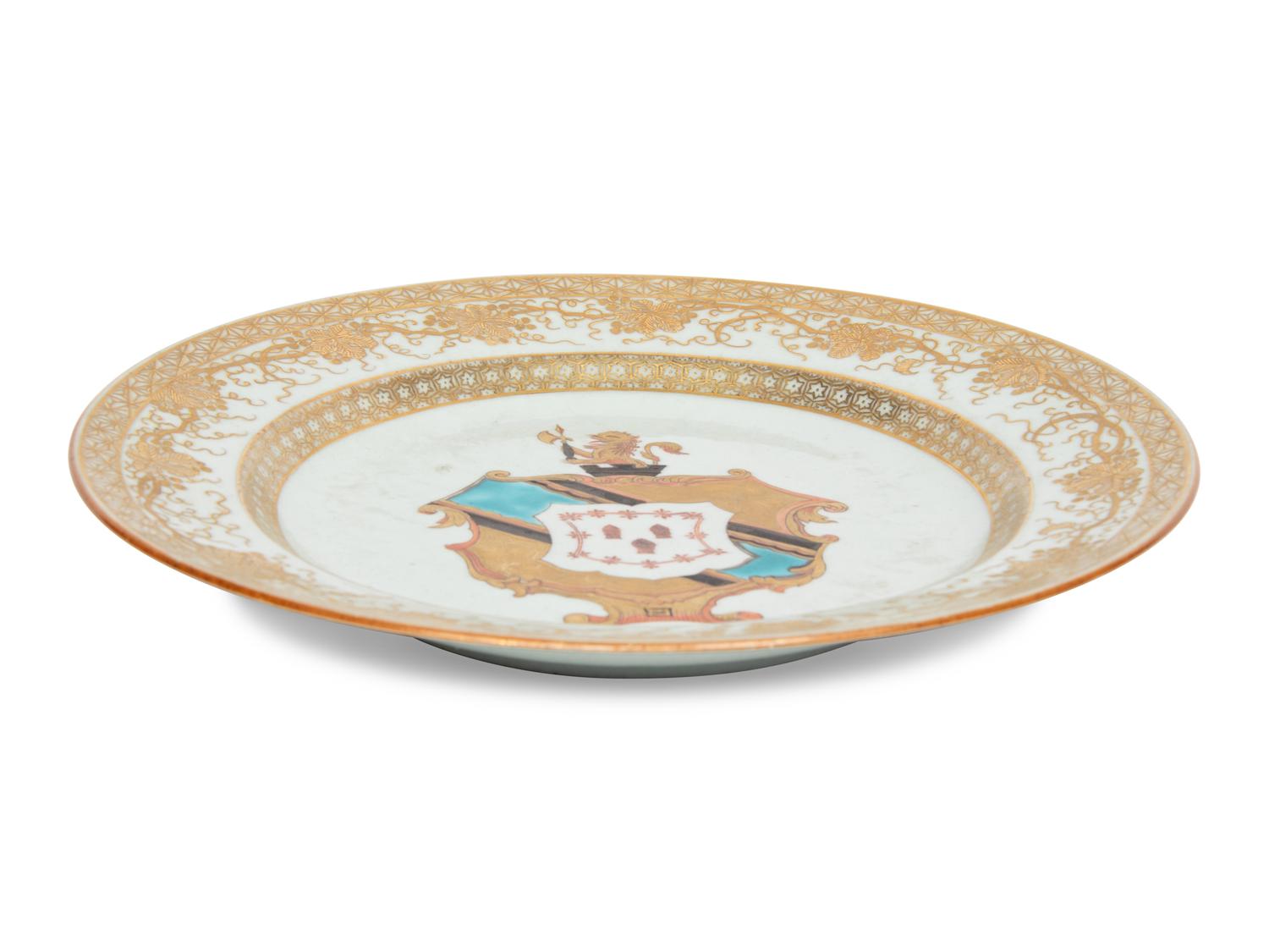 A Chinese Export Porcelain Parcel-Gilt Armorial Plate